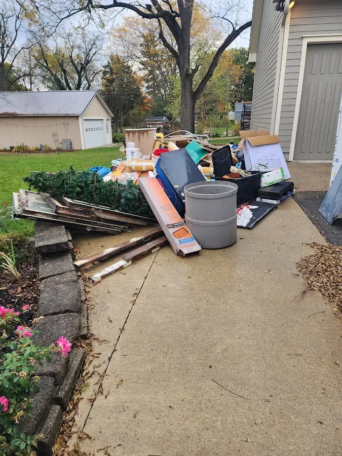 Dumpster being loaded with debris for Commercial Dumpster Rental in Lilburn